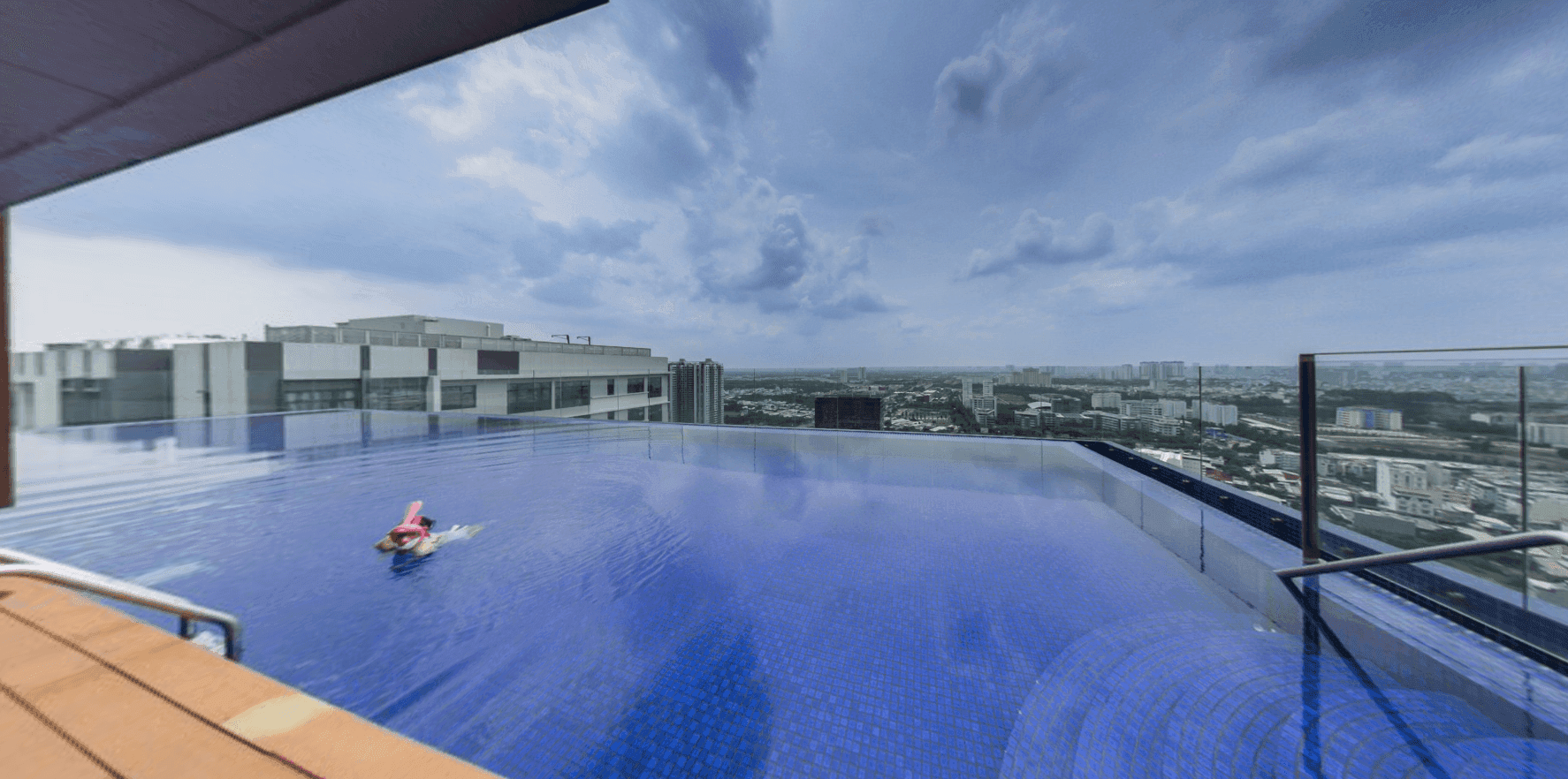 Rooftop pool overlooking the city at Richlane Residence